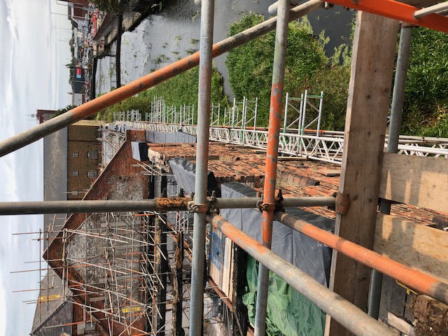the wall in danger of collapse